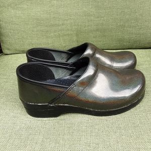 Dansko patent leather green metallic clogs.